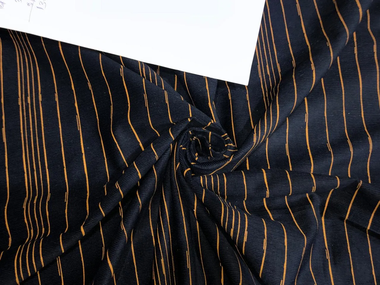 100% Cotton  corduroy Print 56" wide available in 2 styles  Navy with mustard stripe and Navy WITH